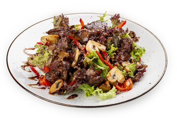 Salad with chicken liver, sweet pepper and champignons. Isolated on a white background.