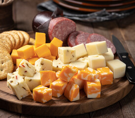 Cheese platter with sausage and crackers - 475860912