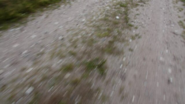 Fast moving dusty village road.
