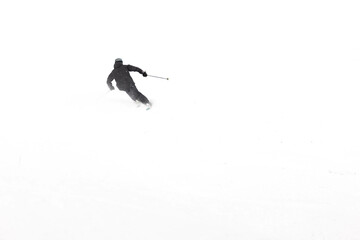 Skier on a slope. Winter sports. Winter landscape with a skier on a slope