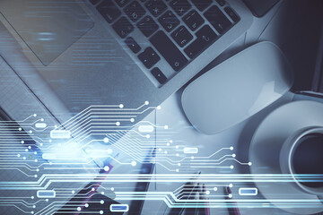 Double exposure of data drawing hologram over topview of study desk background with computer. Concept of Ai.