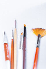 close-up set of nail brushes on a white background