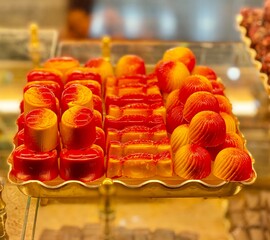 delicacy, sweets, orange candies, lying on a beautiful tray.set of chocolates