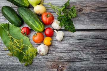 Vegetables for cooking on a wooden background. Environmentally friendly products. Vegetarian set. Pickled vegetables