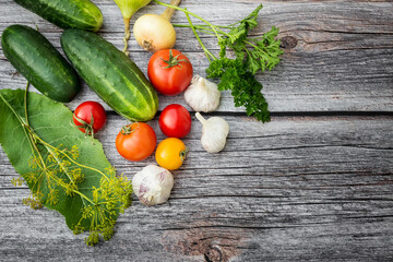 Vegetables for cooking on a wooden background. Environmentally friendly products. Vegetarian set. Pickled vegetables