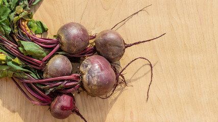 Young beets on a wooden table. Beets from the garden.