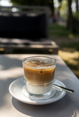 glass of iced coffee on the table at summer terrace