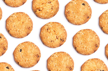 Pattern of vanilla chip butter cookies isolated on white background. Close-up view of brown crackers. Macro shot of yellow biscuit cake leftovers for your design
