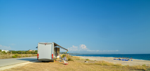 caravan car by the sea and beach in summer season holidays