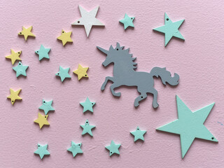 Unicorn, Christmas composition. Christmas decorations Flat lay, top view, stars, wooden toys, new year, trending colors