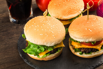 Close up of a homemade delicious beef hamburger on a wooden table.