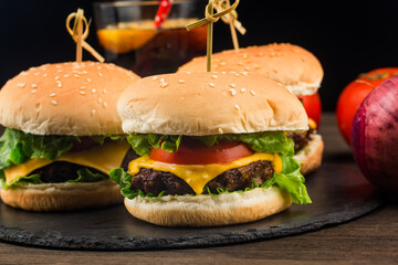 Close up of a homemade delicious beef hamburger on a wooden table.