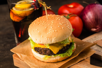 Close up of a homemade delicious beef hamburger on a wooden table.