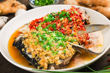 Steamed fish head with diced hot red peppers