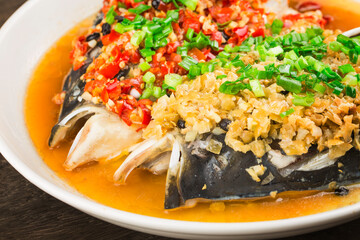 Steamed fish head with diced hot red peppers