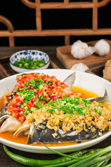 Steamed fish head with diced hot red peppers