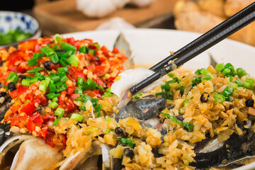Steamed fish head with diced hot red peppers