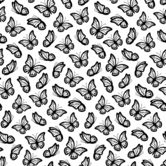 Seamless pattern of butterflies with monarch wings isolated on a white background. Butterfly seamless pattern is great for print gift paper, wedding greeting cards and fabrics