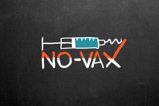 Covid-19 Anti Vax. Anti Vaccination Symbol.  No-Vax movement. A syringe collides and breaks against no-vax. Denial, blame.
