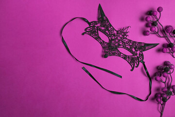 Happy New Year and Merry Christmas 2022. Carnival mask on a trendy purple background. Flat lay. Place for your text.