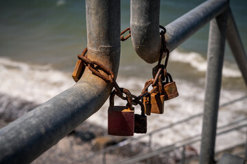Rusty love locks, seen near Nienhagen, Mecklenburg-Western Pomerania, Germany