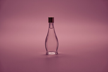 Transparent flask with liquid on a light background