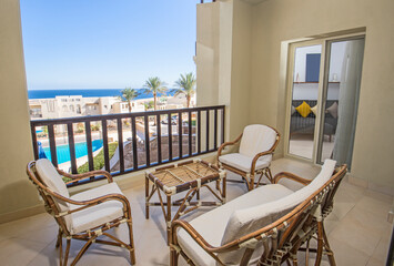 Terrace balcony with chairs in tropical luxury apartment resort