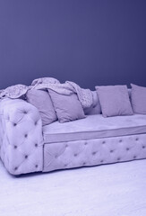 sofa with pillows color of the year 2022 very peri