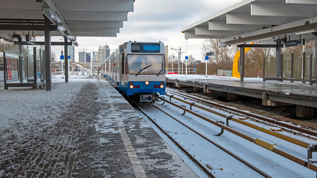 Metro departing from Station Van der Madeweg in Amsterdam netherlands in winter