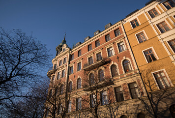 Fototapeta premium Old 1800s apartment house with a tower a sunny winter day in Stockholm