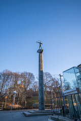 Statue the Archer on a pillar fundament on the island Djurg&aring;rden a sunny winter day in Stockholm