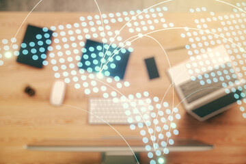 Abstract creative world map with connections on modern laptop background, international trading concept. Multiexposure