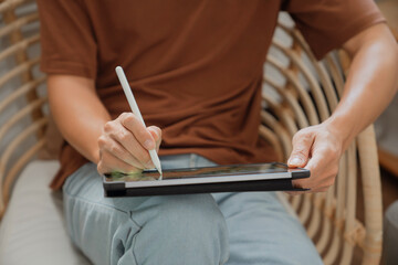 Artist or creative designer drawing on digital tablet with new project design..