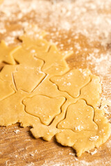 the process of making cookies, dough and flour on the table.