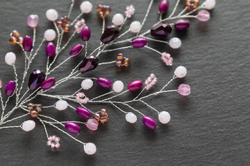Handmade crafted jewelry purple branch embellishment close up