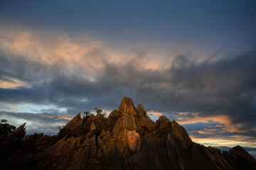 Mountain sunset with the abstract cloud sun beam effect