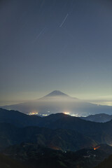 Mt. Fuji Over an Iridescent Sea of Clouds at Night