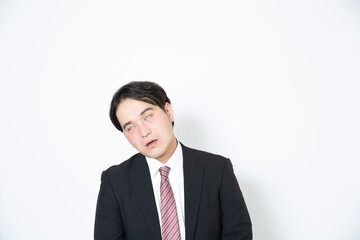 白目を剥いているビジネスマン