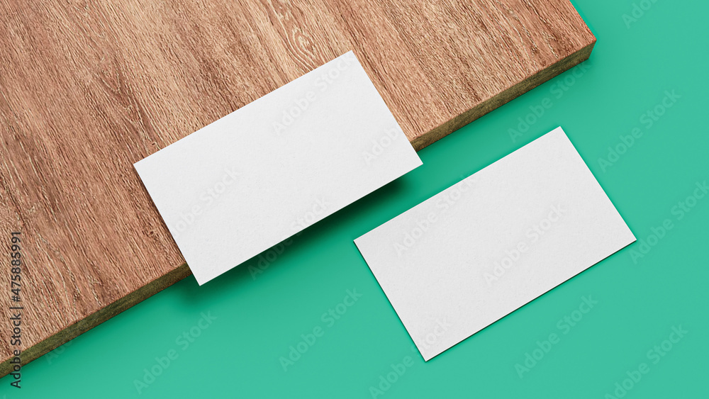 Sticker 3d rendering of blank business cards with copy space on a wooden board on a green surface