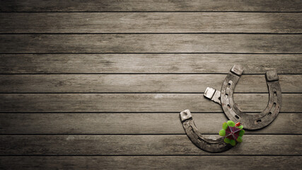 Horseshoe with lucky clover on wooden background. 3d illustration