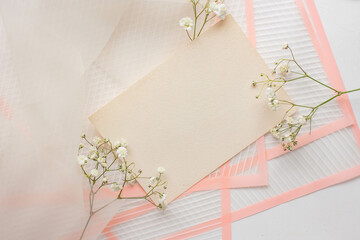 card mockup with white flowers and envelope. wedding invitation 
