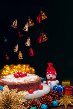 Christmas Plum cake with icing and cherry on top 