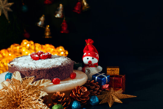 
Christmas Plum cake with icing and cherry on top 