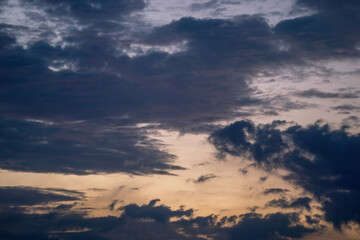 Beautiful view of sky with clouds at sunrise. Partly cloudy. Colorful sunset. Natural blue sky background texture, beautiful color.