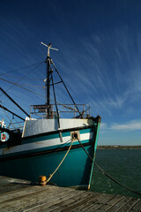 Sail boat on the sea with a beautiful blue sky over the ocean
