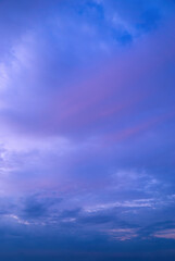 Beautiful view of sky with clouds at sunrise. Partly cloudy. Colorful sunset. Natural blue sky background texture, beautiful color.