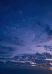 Beautiful view of sky with clouds at sunrise. Partly cloudy. Colorful sunset. Natural blue sky background texture, beautiful color.