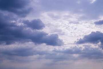 Beautiful view of sky with clouds at sunrise. Partly cloudy. Colorful sunset. Natural blue sky background texture, beautiful color.