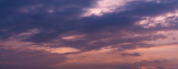 Beautiful view of sky with clouds at sunrise. Partly cloudy. Colorful sunset. Natural blue sky background texture, beautiful color.