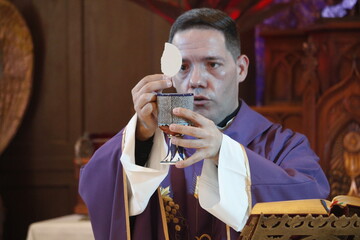 a priest celebrates a mass in lent 